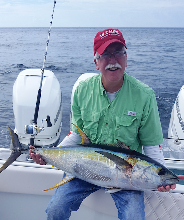 Professor Glenn Parsons with a tuna fish. 